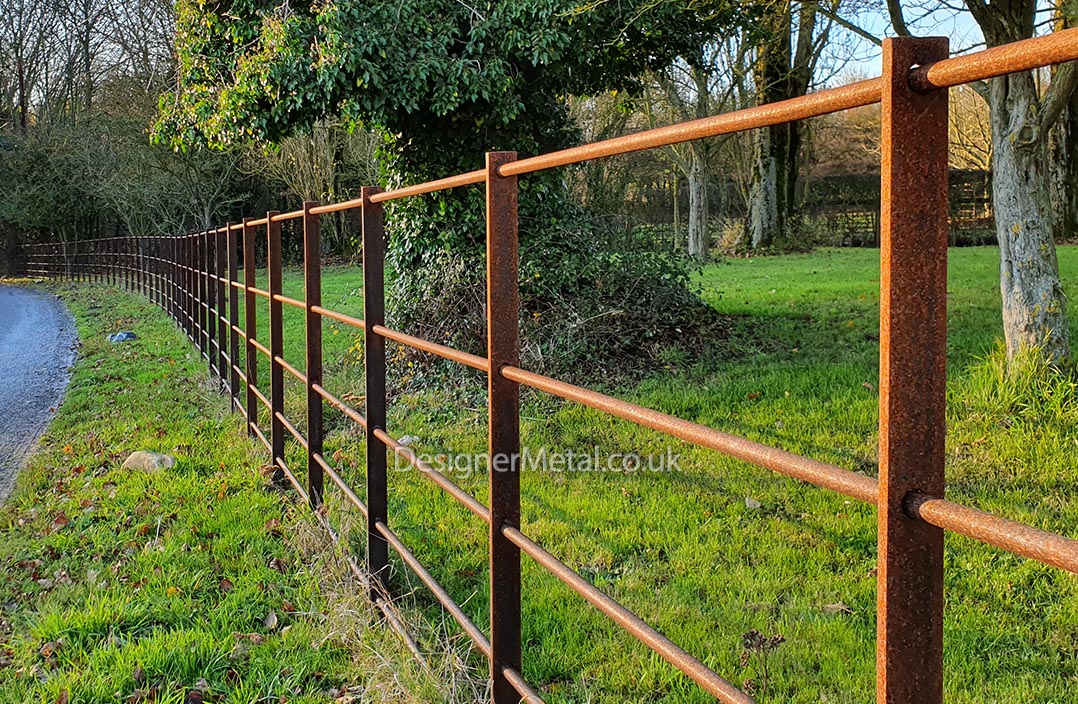 Estate fencing with rust finish. Estate fencing installation with rust finish.