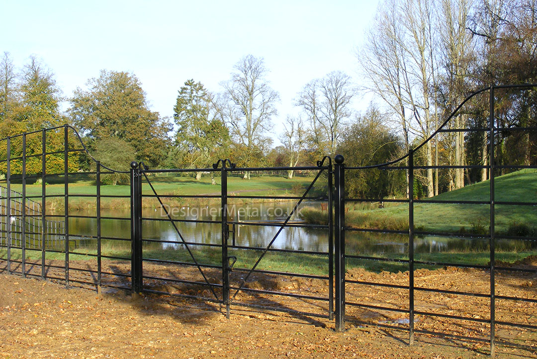 Deer fencing swooping down to a lower set of gates. Deer fencing swooping down to a lower set of gates.
