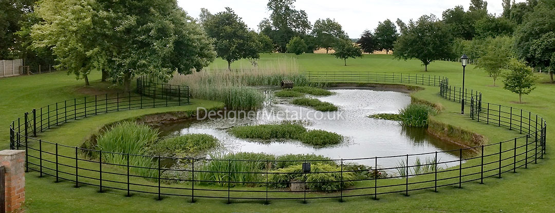 Installation of estate fencing around a pond Installation of estate fencing around a large pond